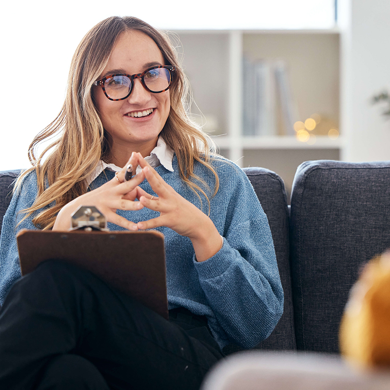 Speech therapist talking client.