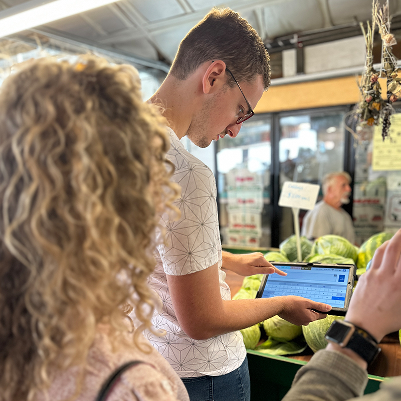 Young man using type app market.