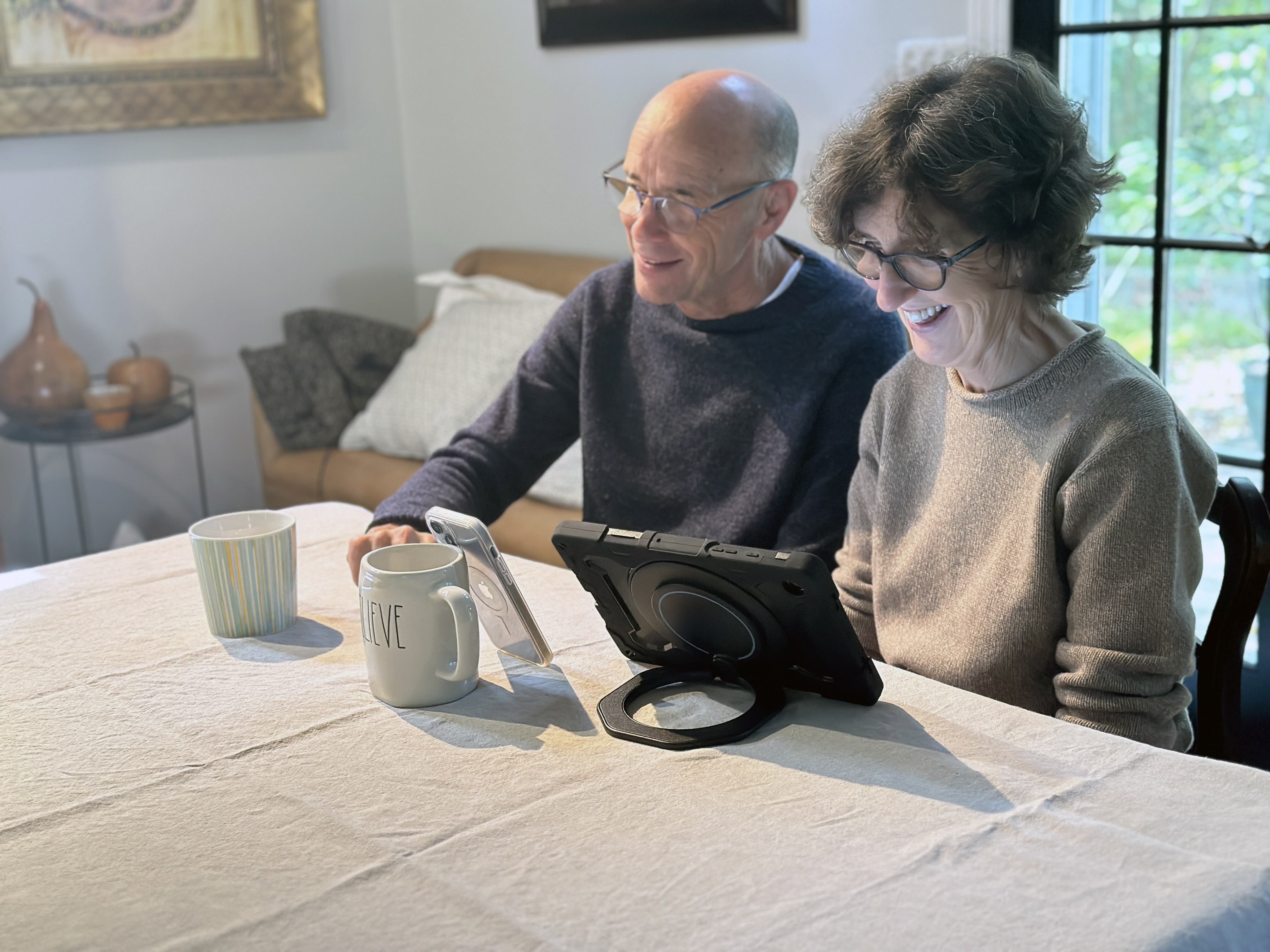 Happy couple using an aac device