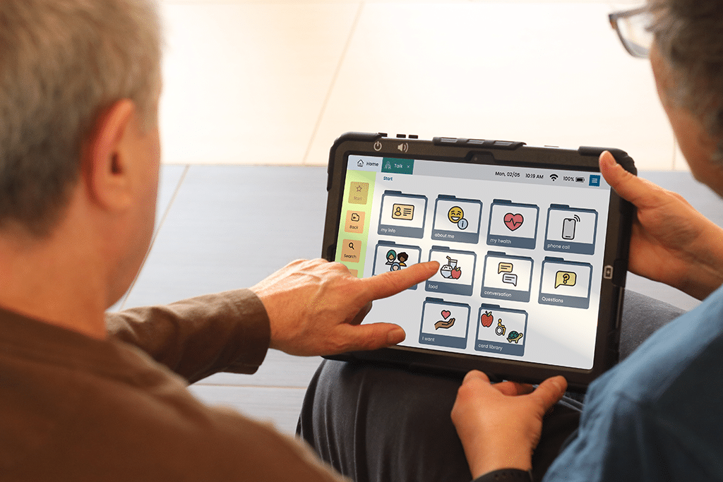 Man and woman over the shoulder view using Lingraphica Hub software