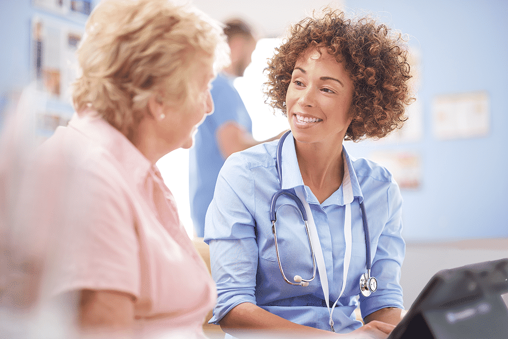 Speech-language pathologist with her patient