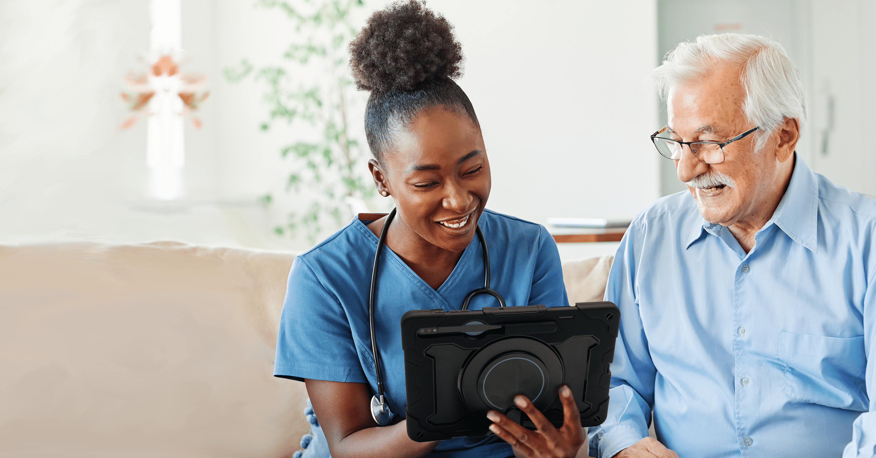 Image of an SLP showing client how to use an AAC device