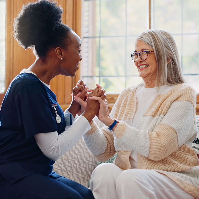 Speech therapist and client celebrating.